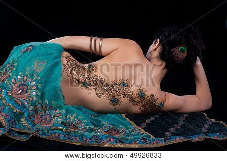Peacock Feather Henna Design On A Woman's Back