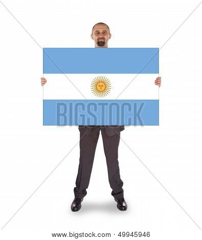 Smiling Businessman Holding A Big Card, Flag Of Argentine