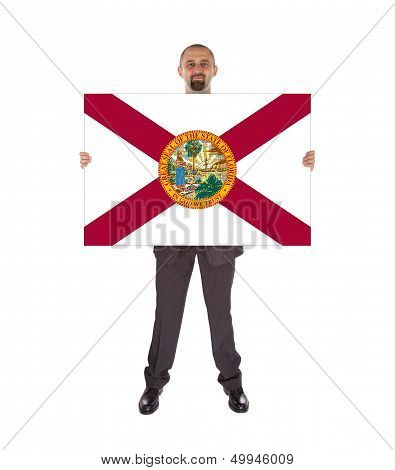 Smiling Businessman Holding A Big Card, Flag Of Florida