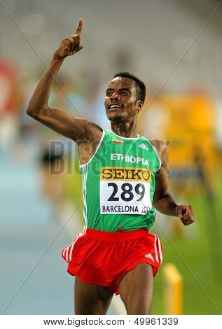 BARCELONA - JULY, 14: Muktar Edris of Ethiopia celebrates his victory on 5000 meters of the 20th World Junior Athletics Championships at the Olympic Stadium on July 14, 2012 in Barcelona, Spain