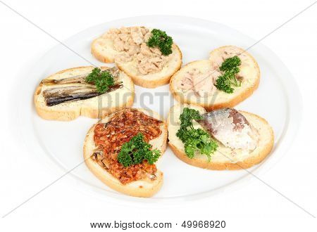 Tasty sandwiches with tuna and cod liver sardines different kinds of canned fish, isolated on white