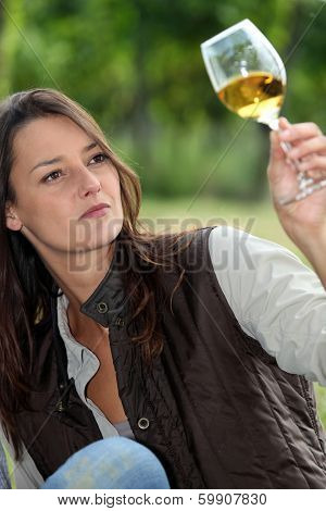 winemaker watching glass of wine