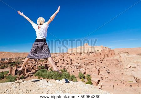 Traveler Jumpin In Front Of Ait Benhaddou, Morocco.