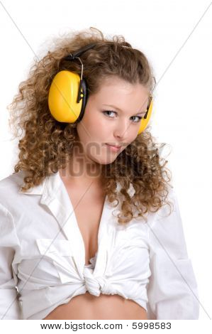 Curly girl in yellow headphones