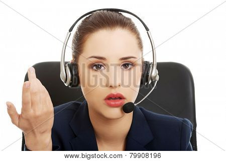 Portrait of anoyed support phone operator in headset
