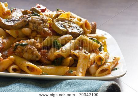 Penne Nostra Italian pasta with mushrooms spinach ground sausage and olive oil