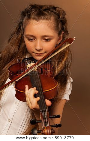 One girl playing the violin on gel background