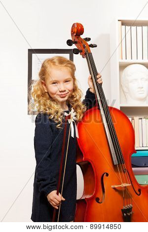 Curly beautiful girl with fiddlestick, violoncello