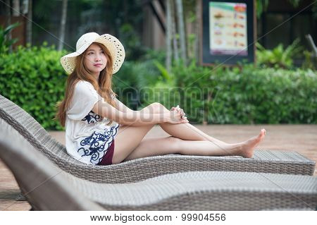Beautiful Relex On Lounger Near Swimming Pool In Hotel, Krabi, Thailand