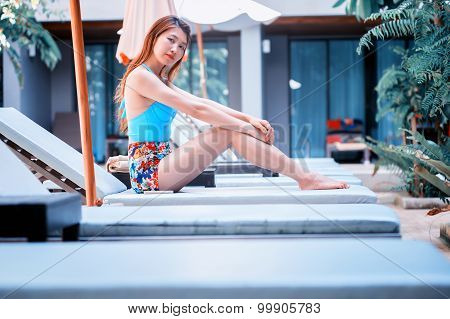 Beautiful Relex On Lounger Near Swimming Pool In Hotel, Krabi, Thailand