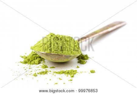 Powder green tea isolated on white background