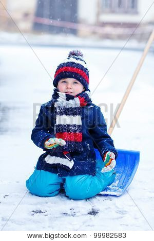 Little Boy Playing With Snow In Winter, Outdoors.