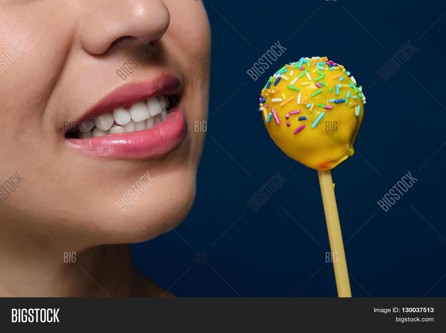 girl with delicious dessert - yellow cakepops