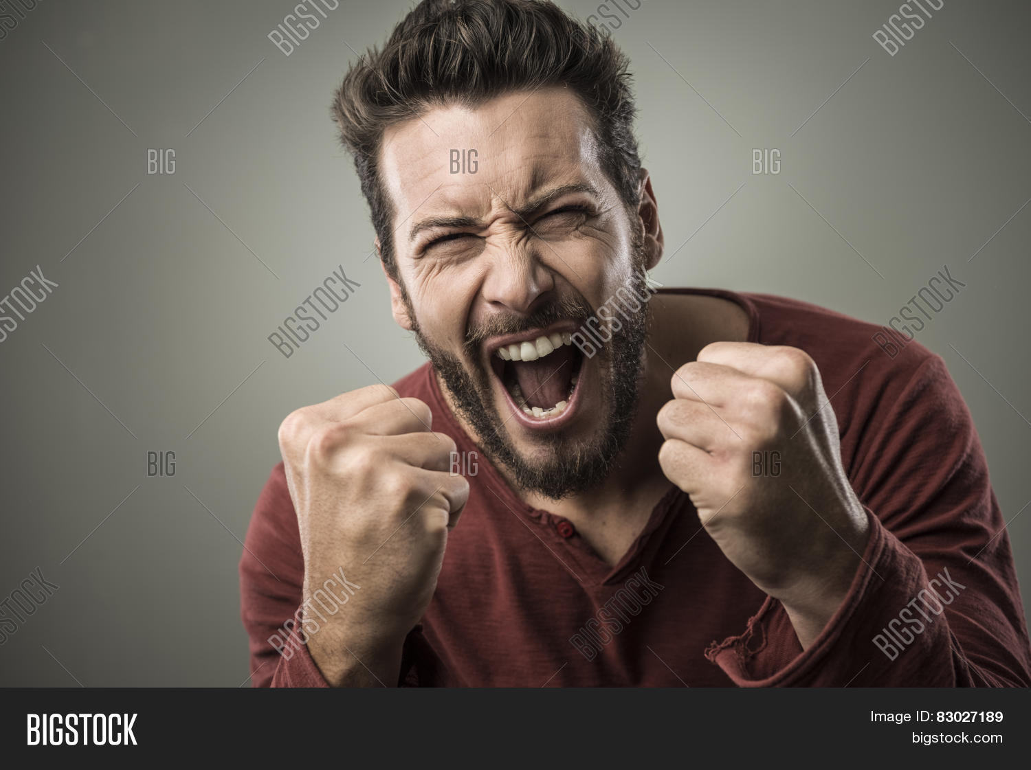 angry aggressive man shouting out loud with ferocious expression