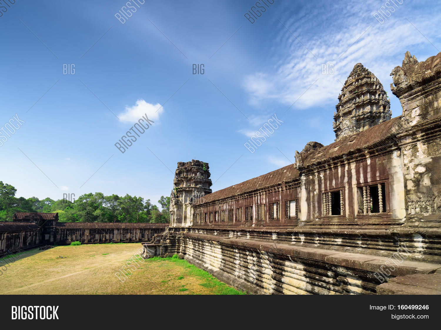 wall of gallery and one of towers ancient angkor wat, cambodia