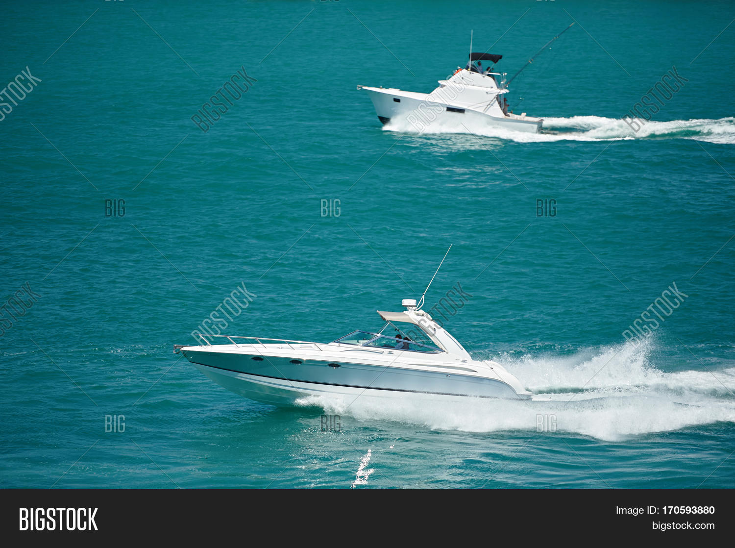 two motor boats at sea
