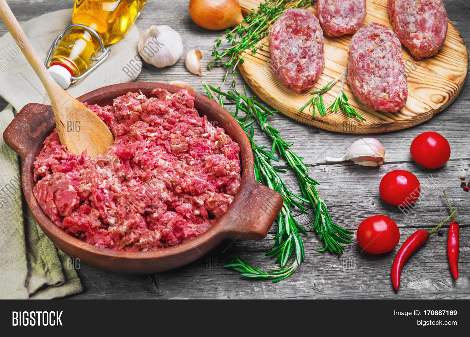 minced meat in a bowl four meat patties.