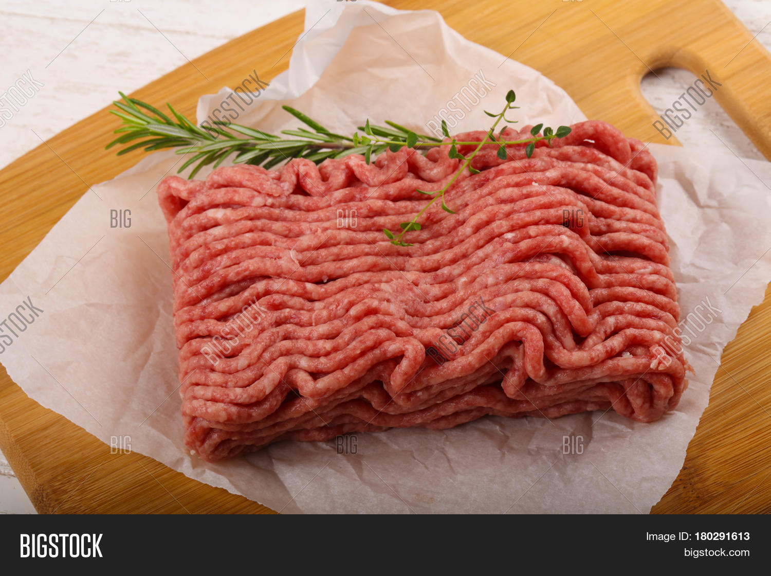 raw minced meat with thyme and rosemary
