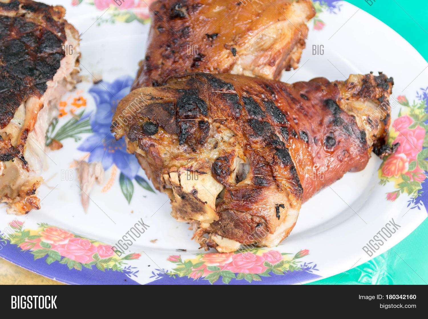 cooked pork shank. meat cooked on fire.