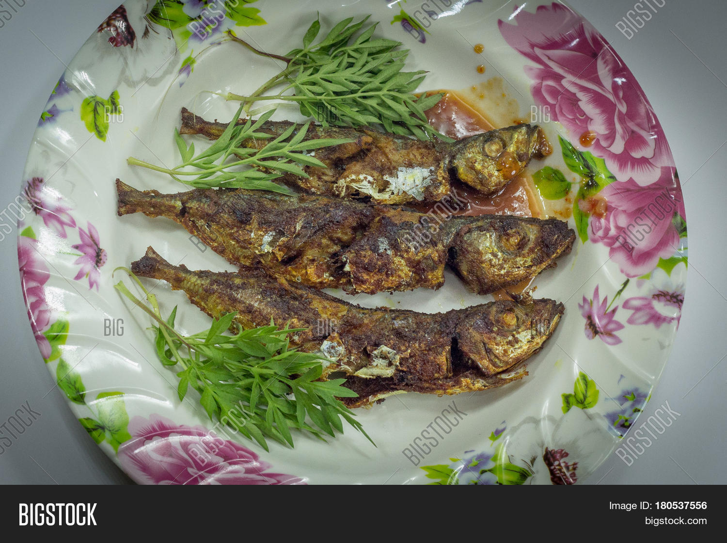 fried fish with sambal is a popular home-style dish in malaysia