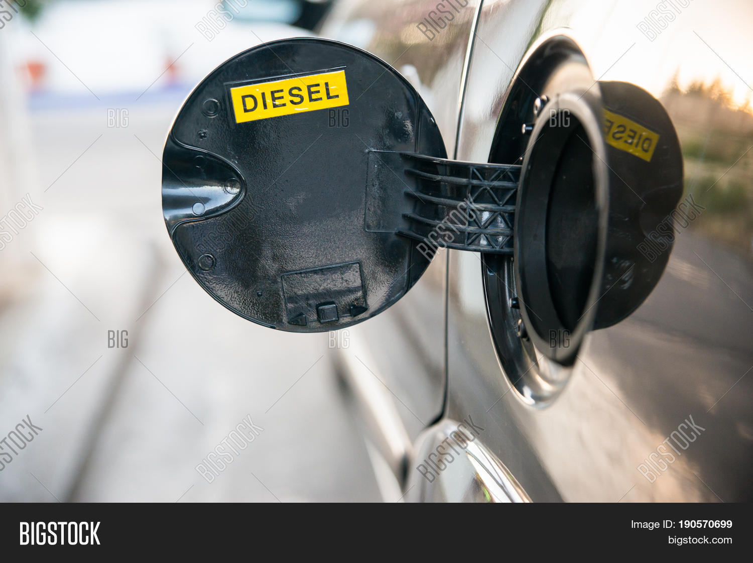 opened car fuel tank with the word diesel. copy space for text