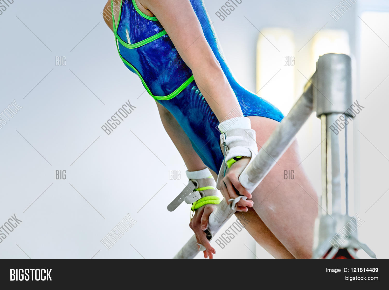 girl gymnast athlete during an exercise horizontal bar in