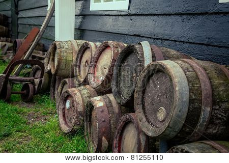 oak barrels of beer near the house