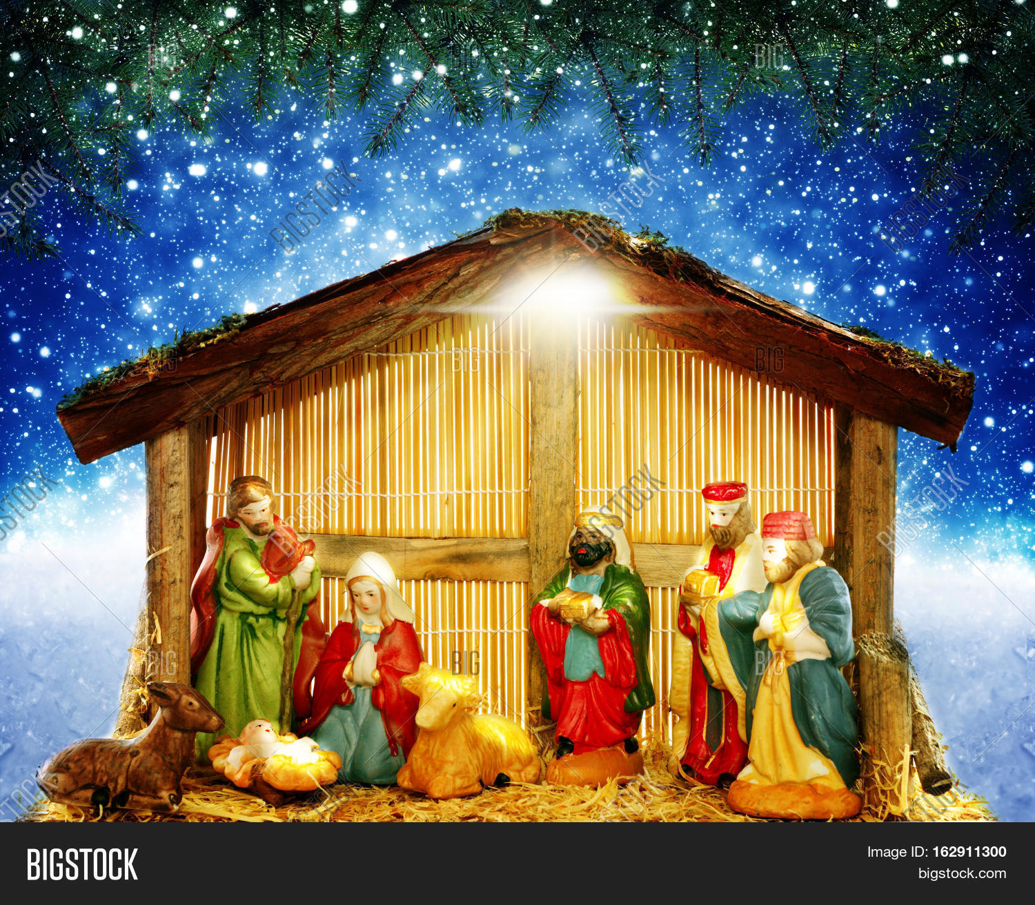 nativity scene in front of starry sky