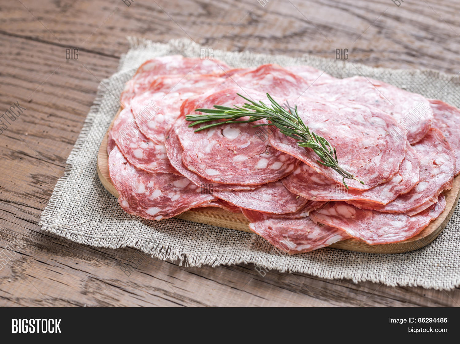 slices of salami on the wooden board