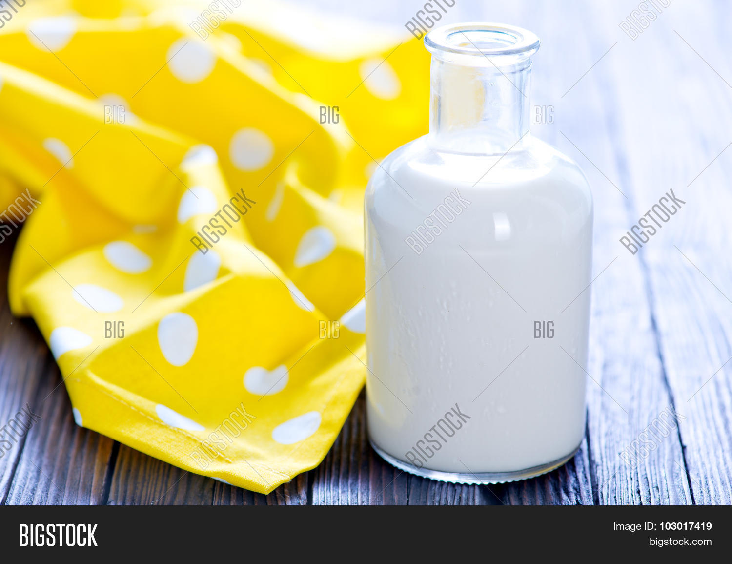 fresh milk in bottle and on a table