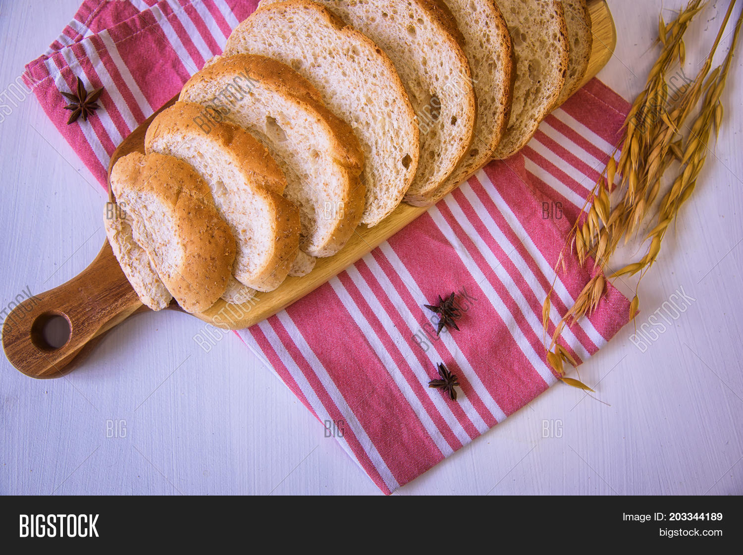 sliced crusty country style round organic french bread on the