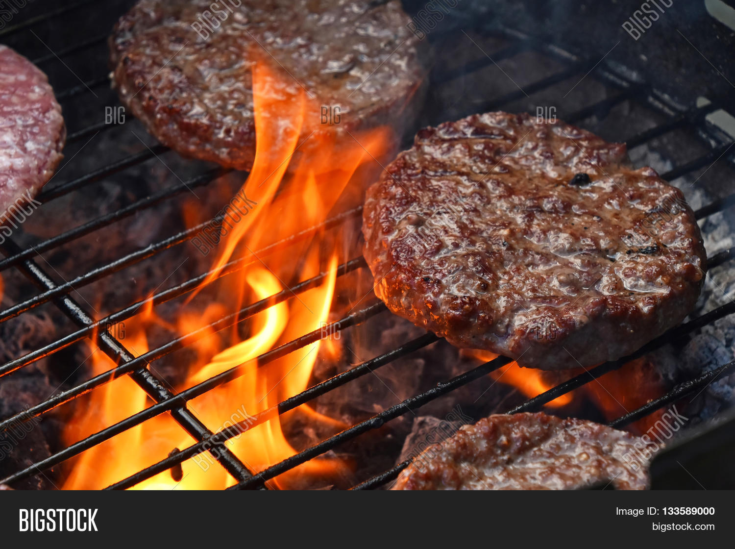 burgers for hamburger prepared grilled on bbq fire flame grill