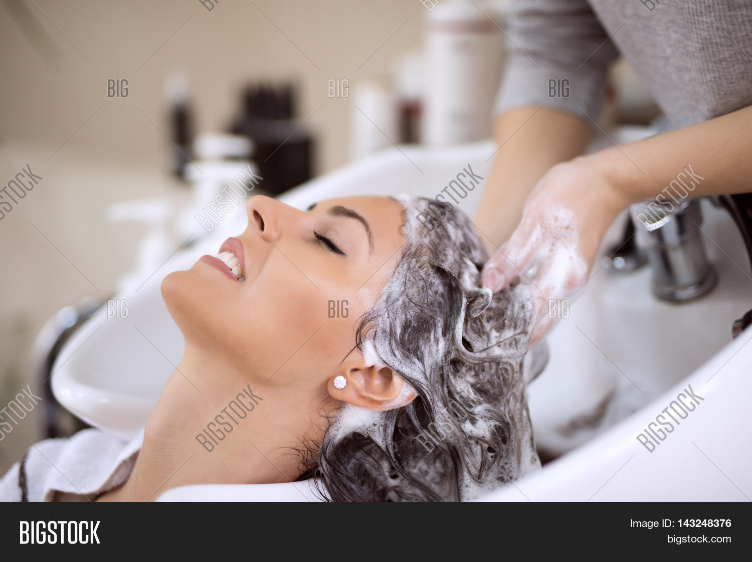 portrait of women which wash hair in a beauty salon.