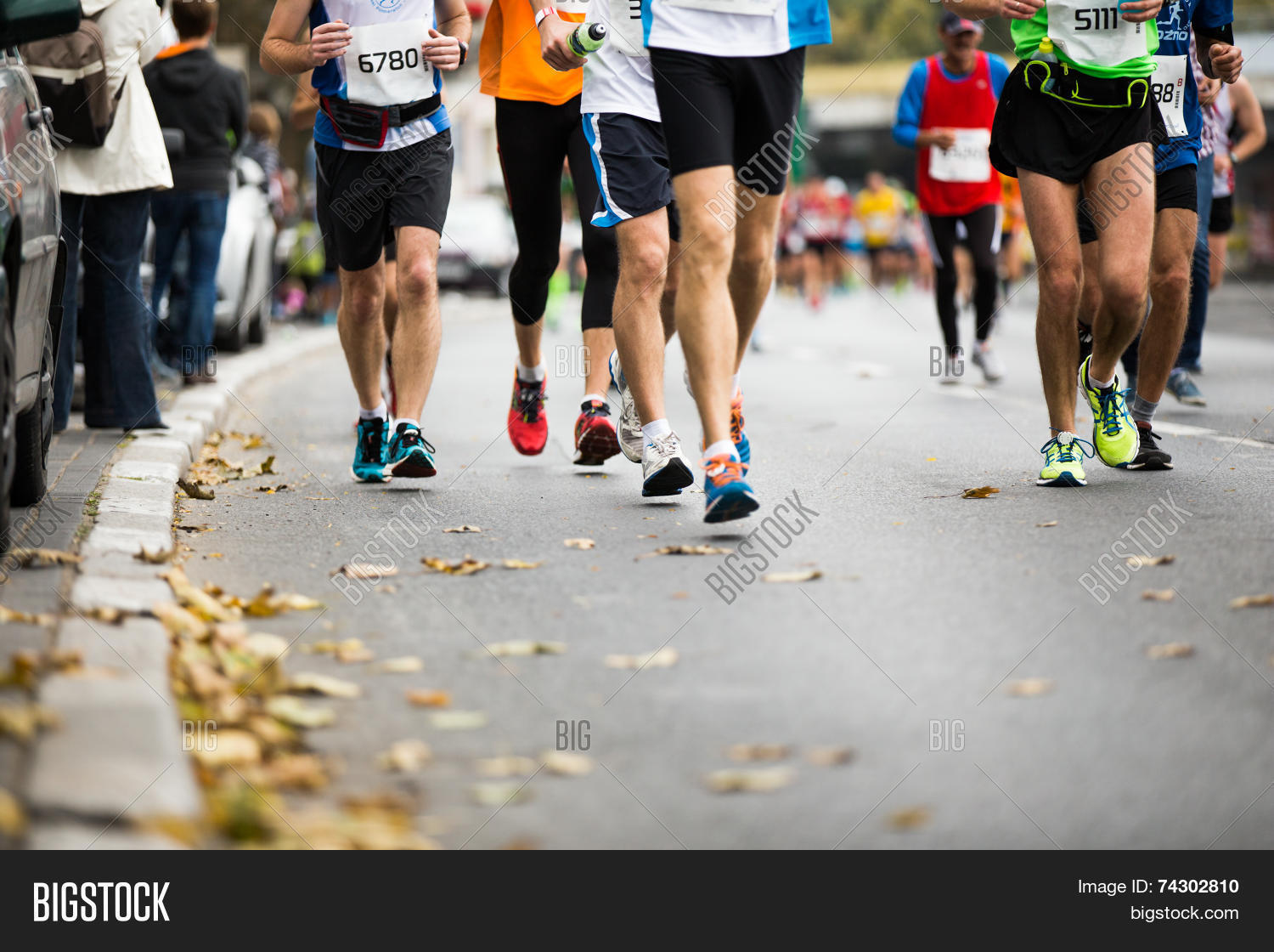 marathon running race people feet on autumn road