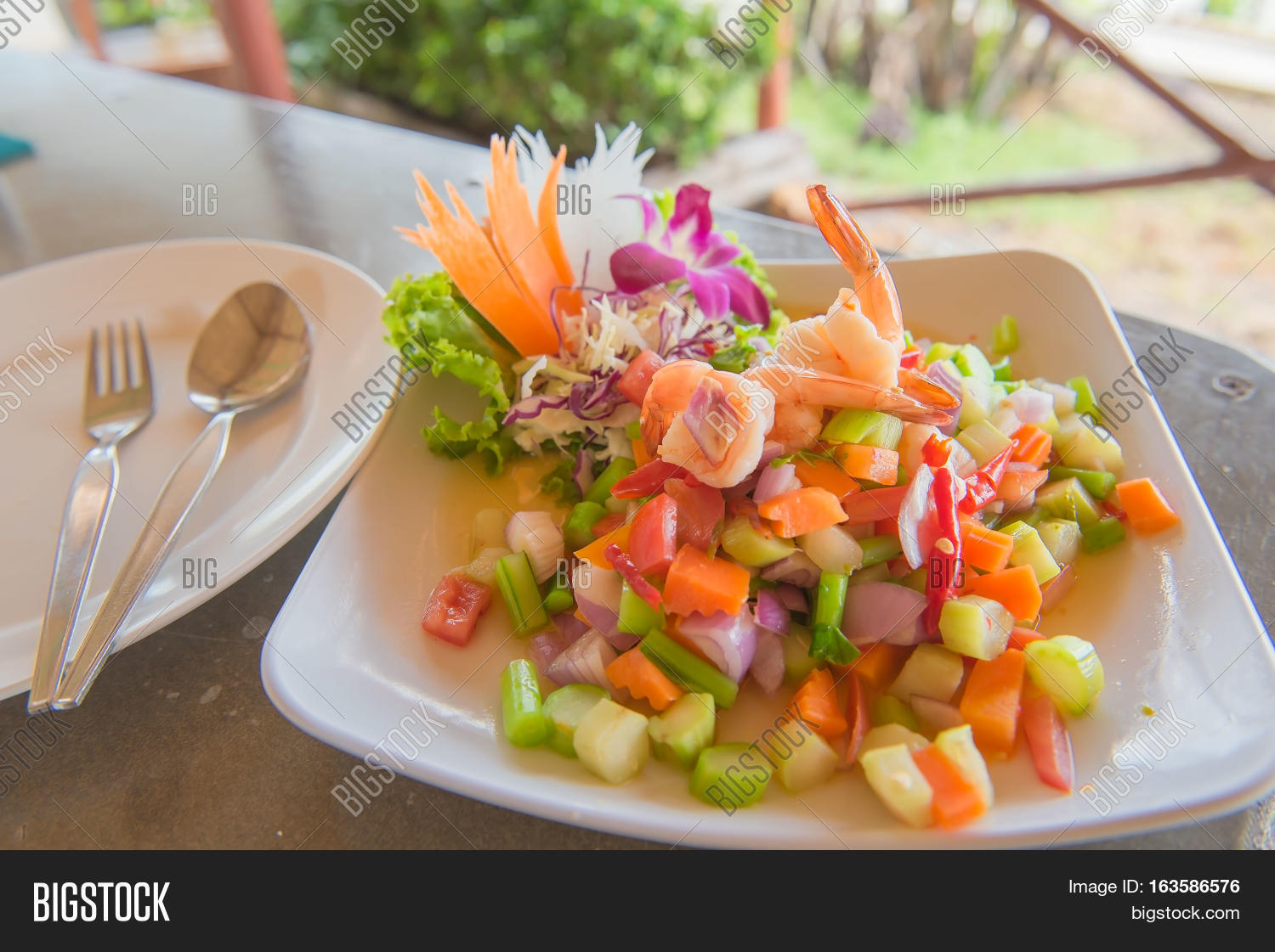 spicy shrimp and mix vegetable salad , thai food.