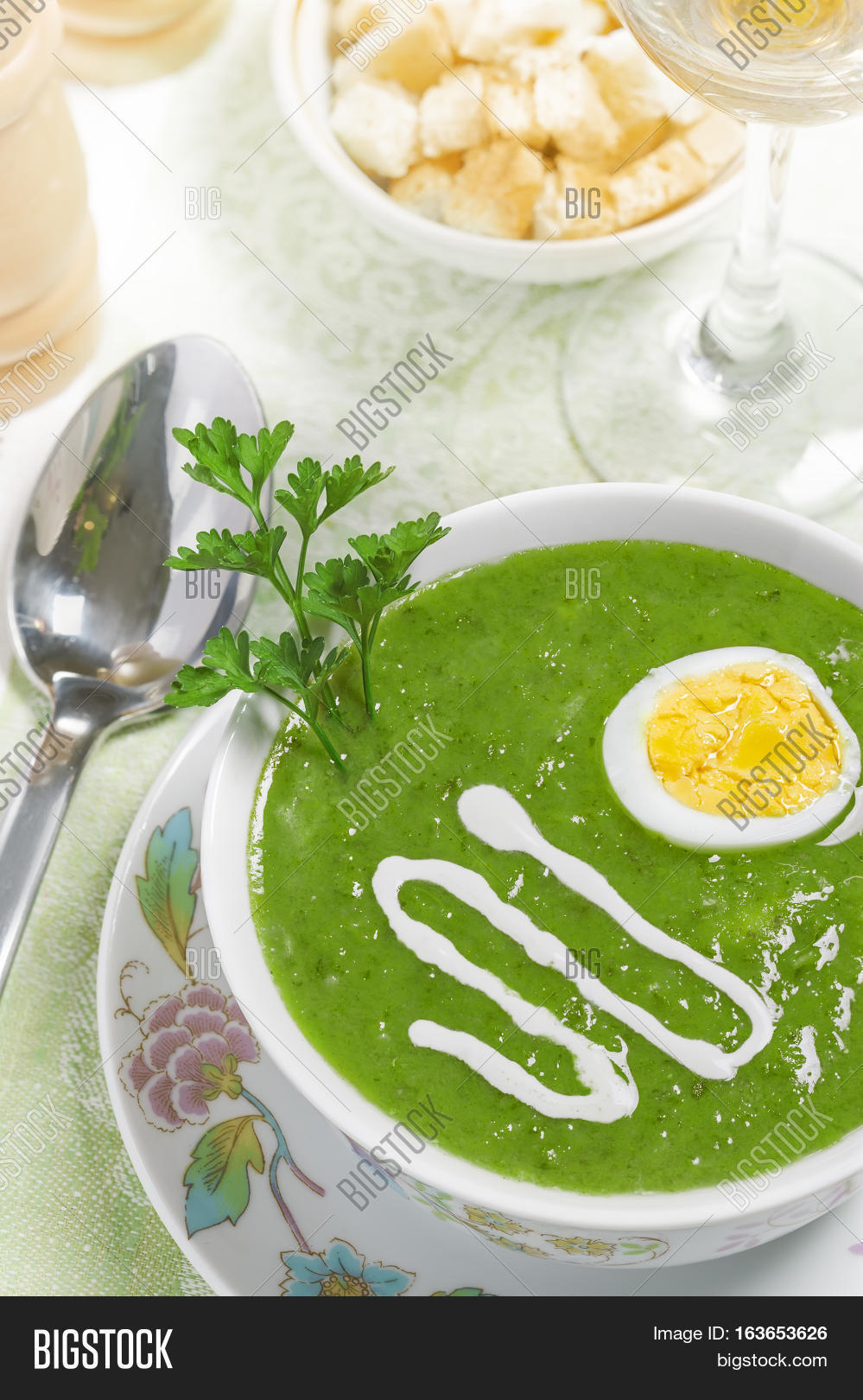 cream soup with egg sour cream and wine on the table studio shot