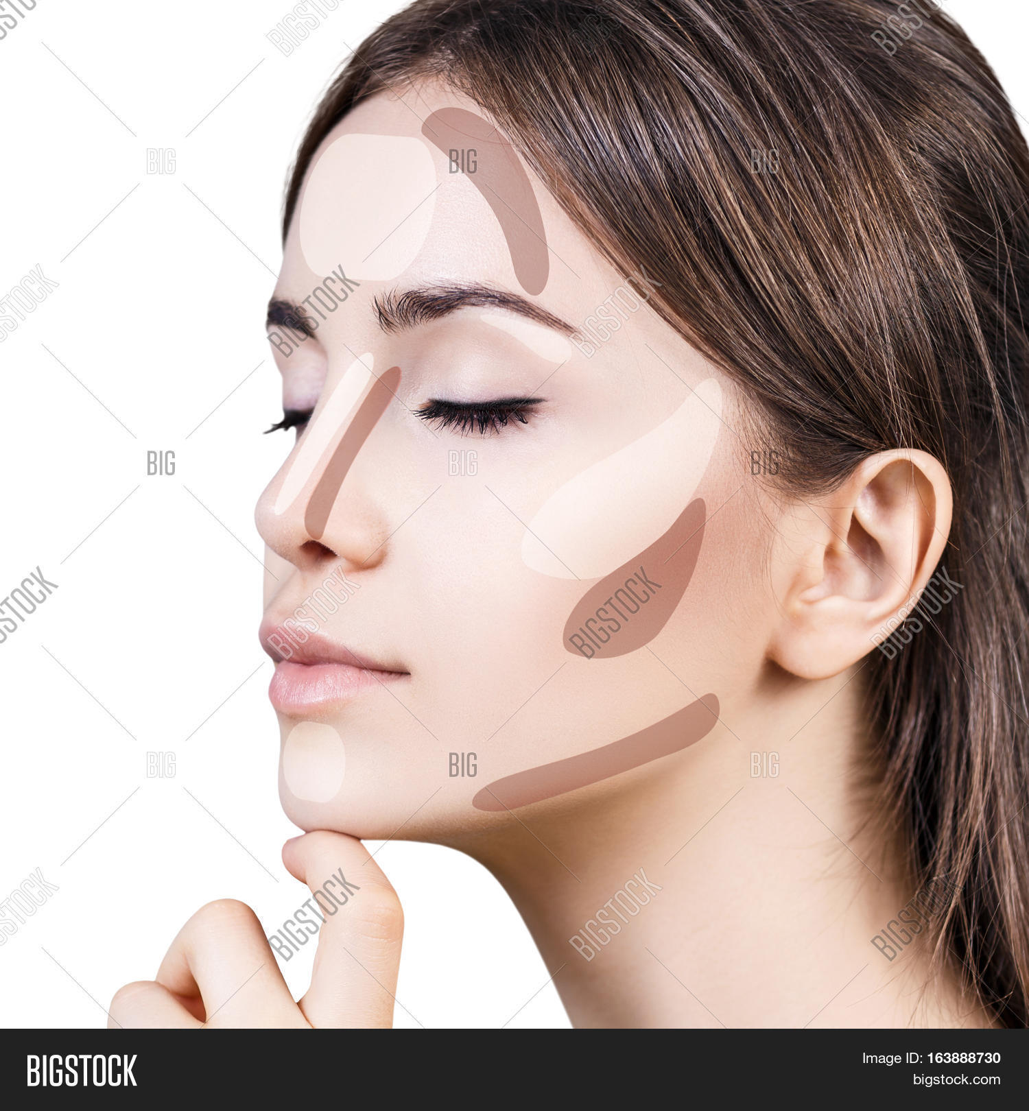 young womans face with contouring makeup.