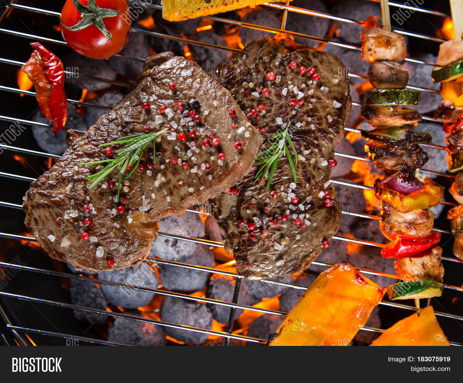 barbecue garden grill with beef steaks, close-up.