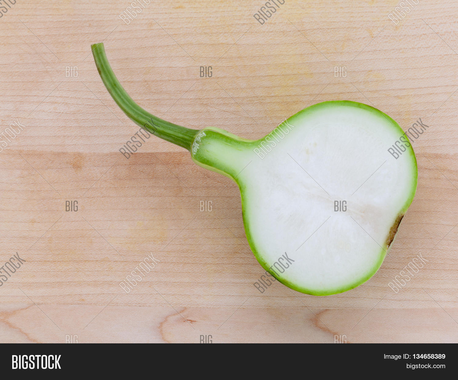 halved bottle gourd or calabash gourd .