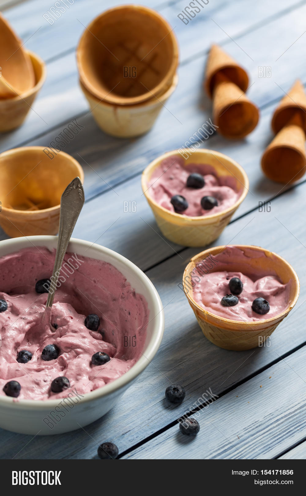 homemade blueberry ice cream with yogurt on old wooden table