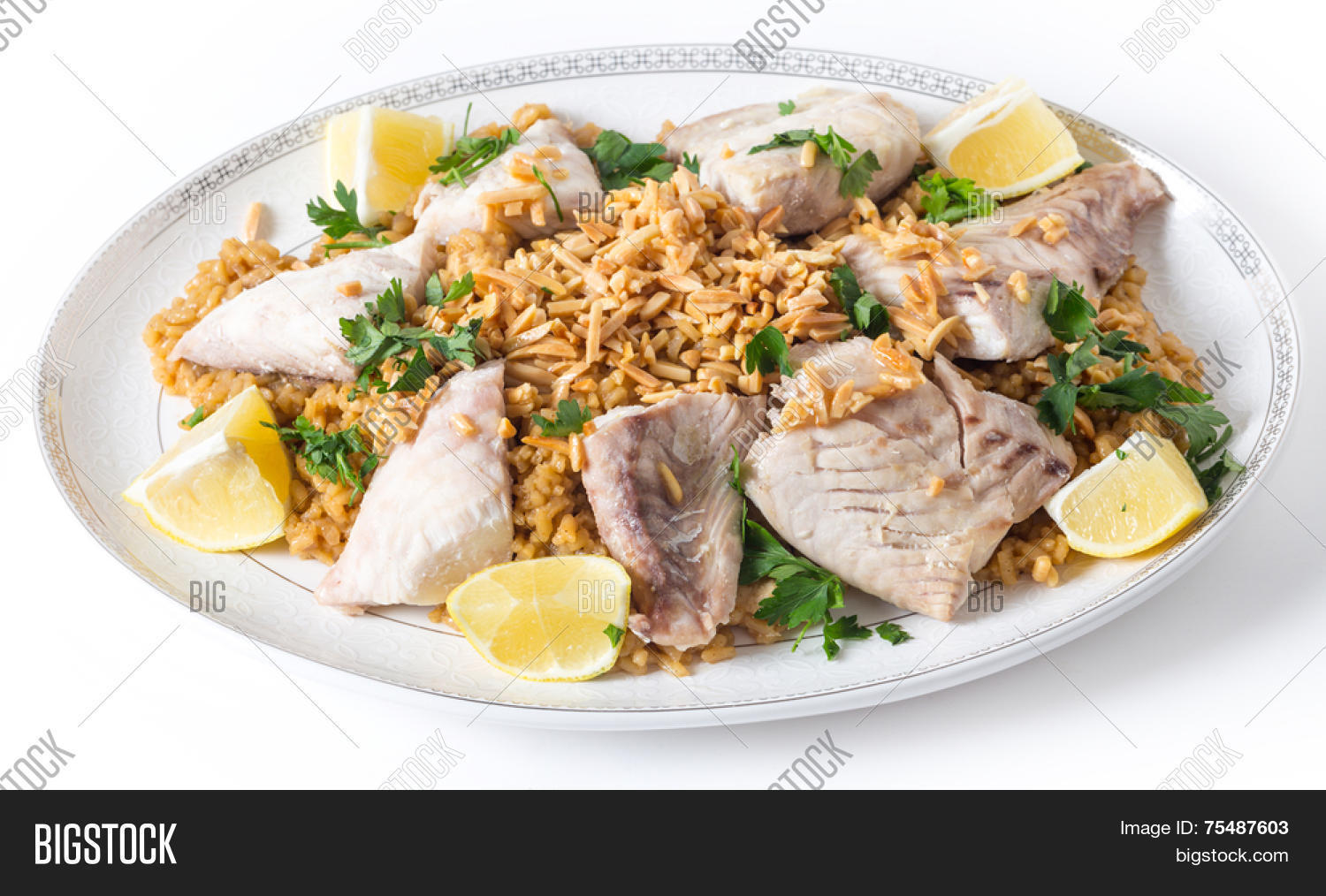fried fish on a serving dish with caramelised onion flavoured