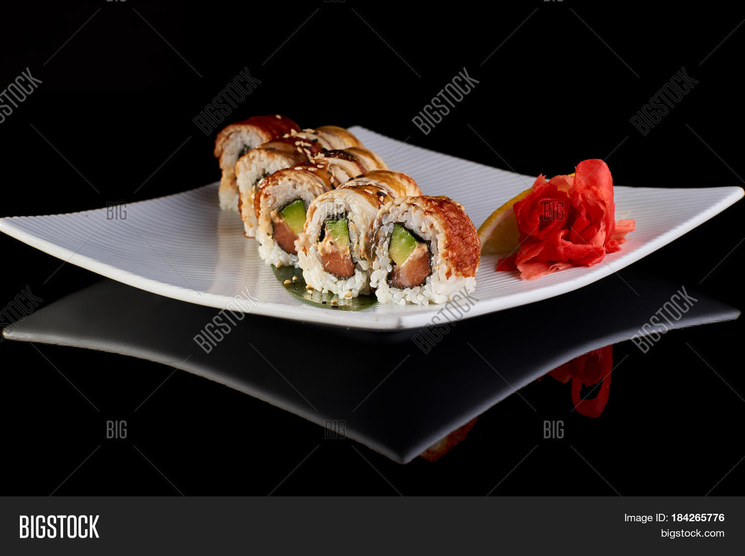 sushi roll with spicy eel fish, avocado and philadelphia cheese