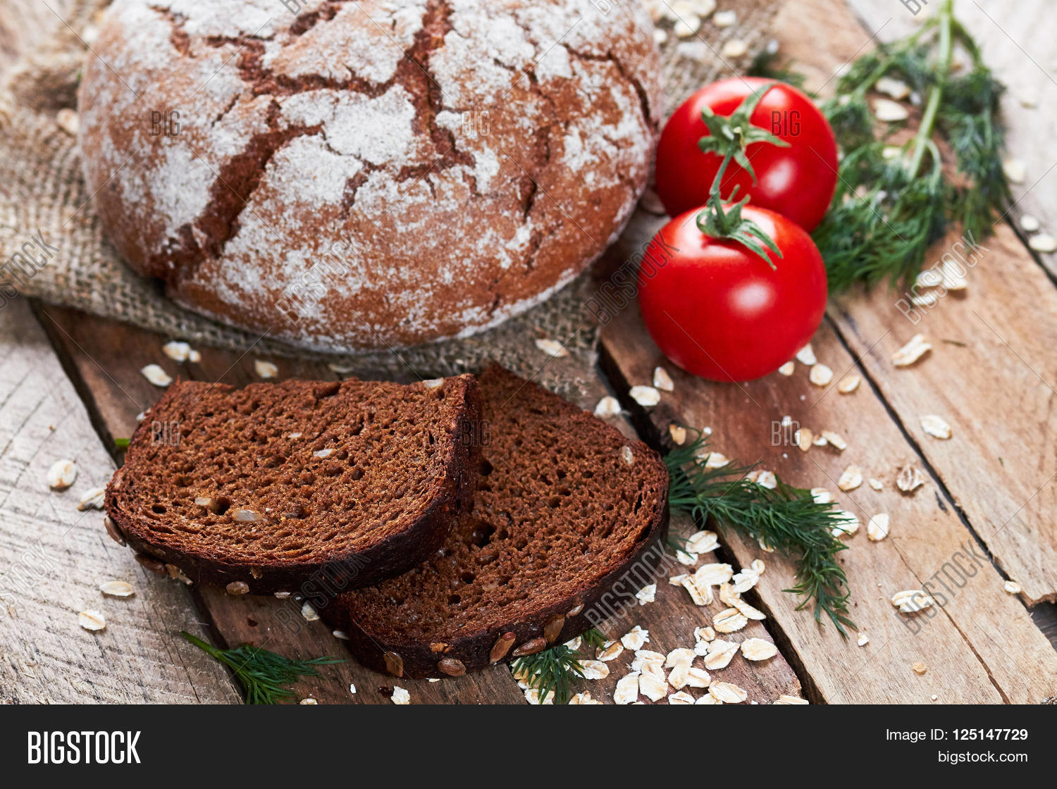 closeup photo of rustic floured bread, two pieces of bread, dill