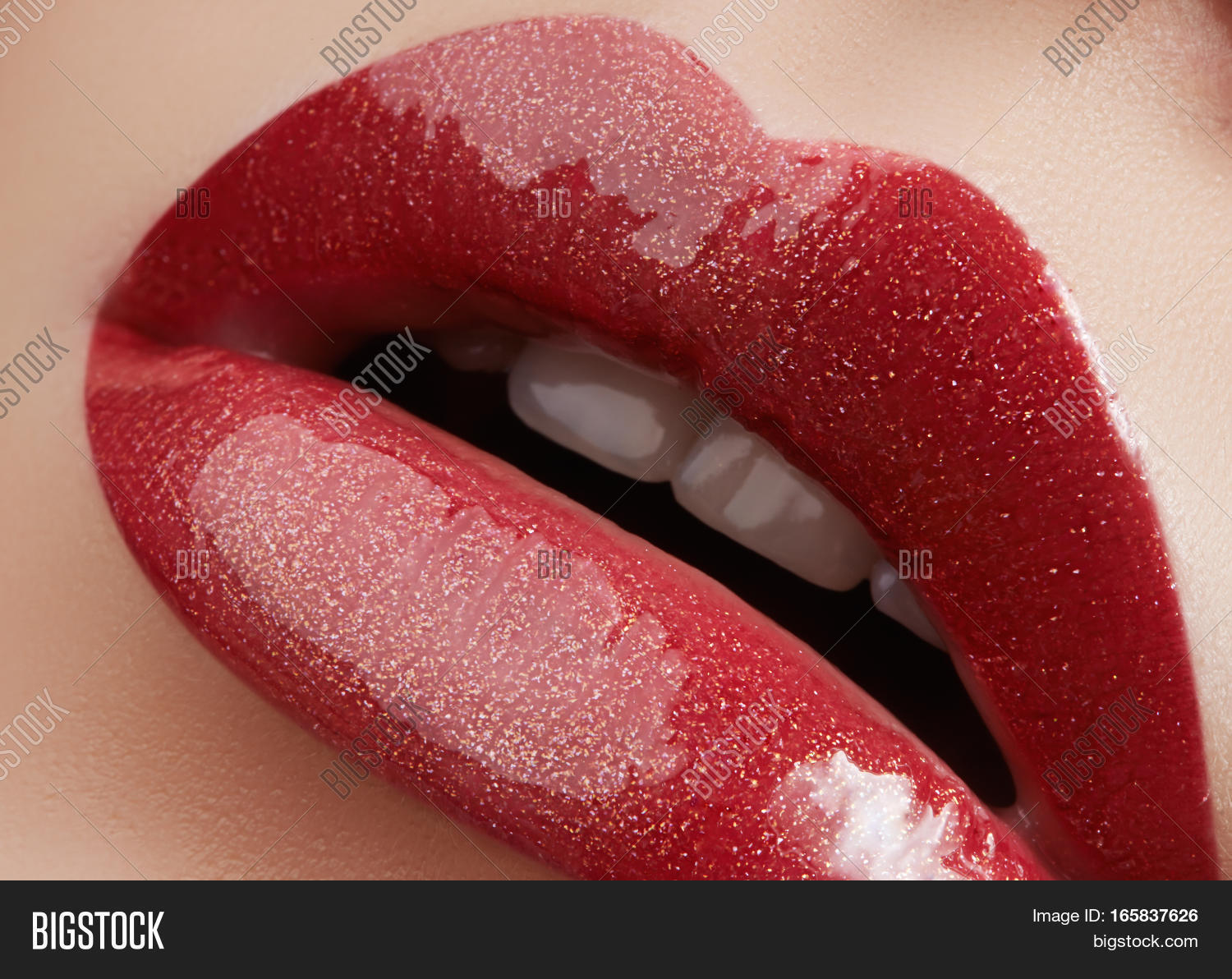 close-up of female lips with bright makeup.