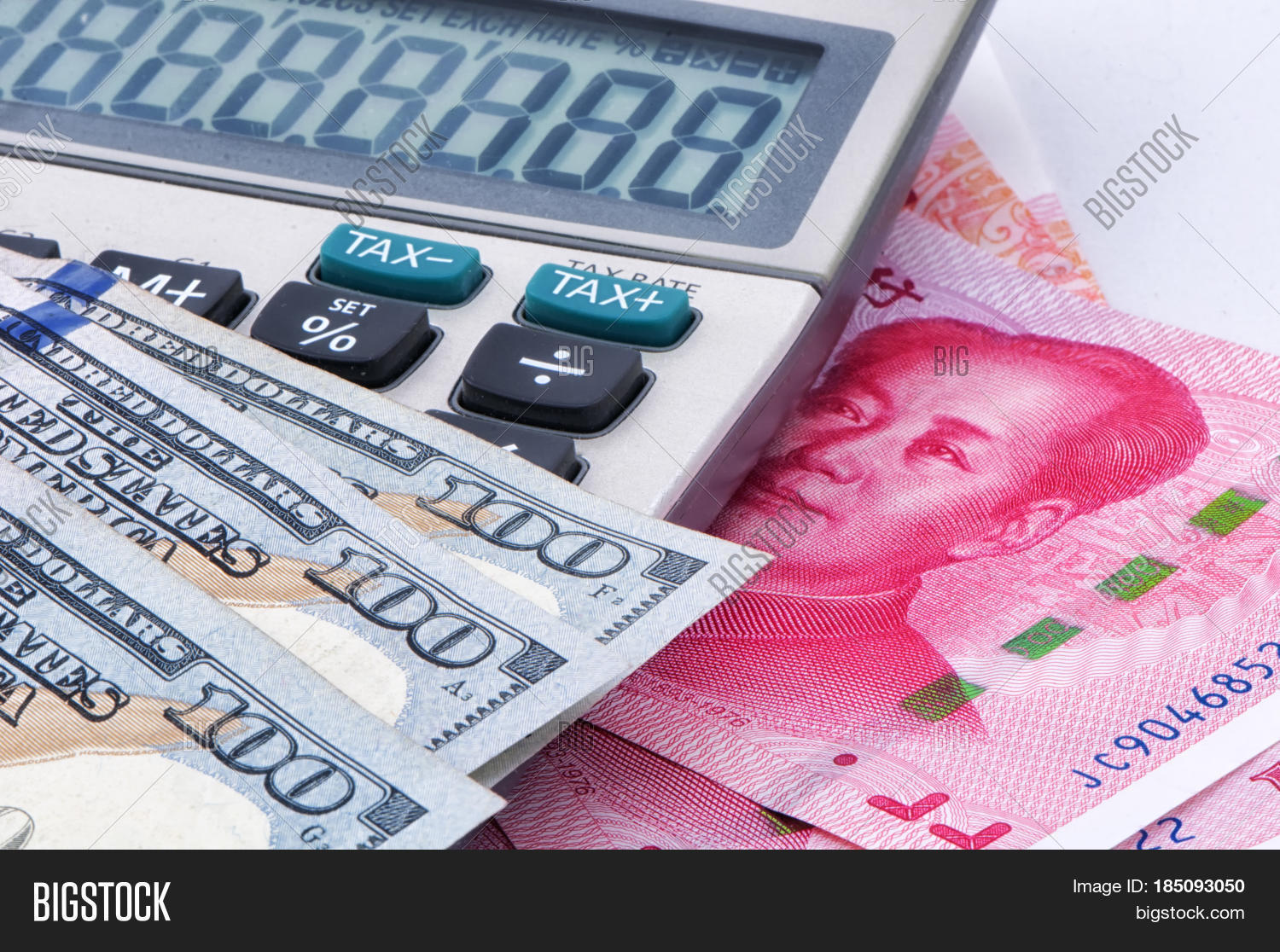 dollar bills piled on a white background.