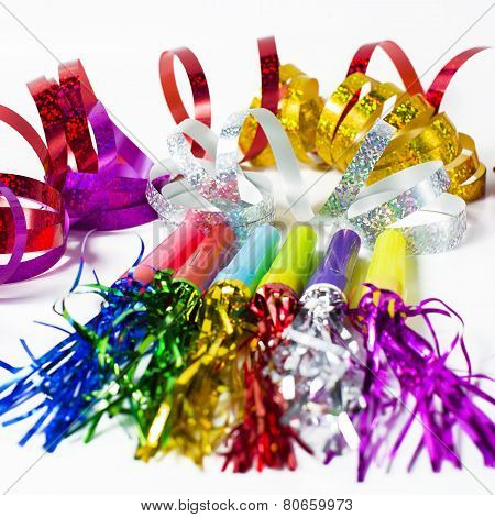 party horn blower with colored streamers on white background