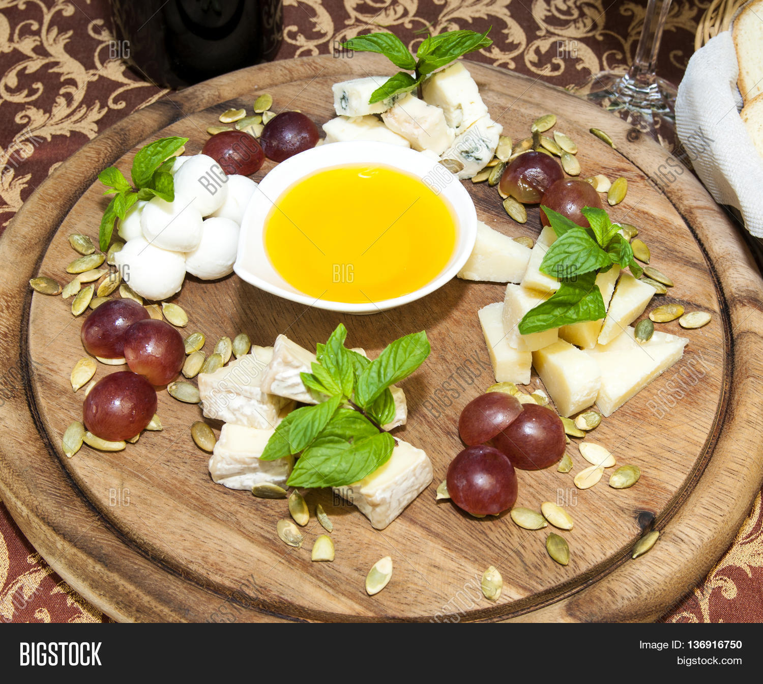 cheese plate with a large decorated the assortment of mint