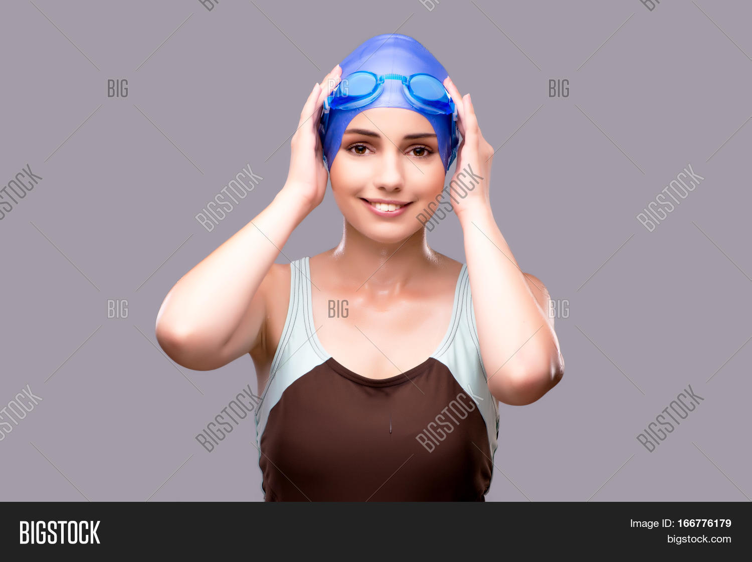 woman swimmer against grey background