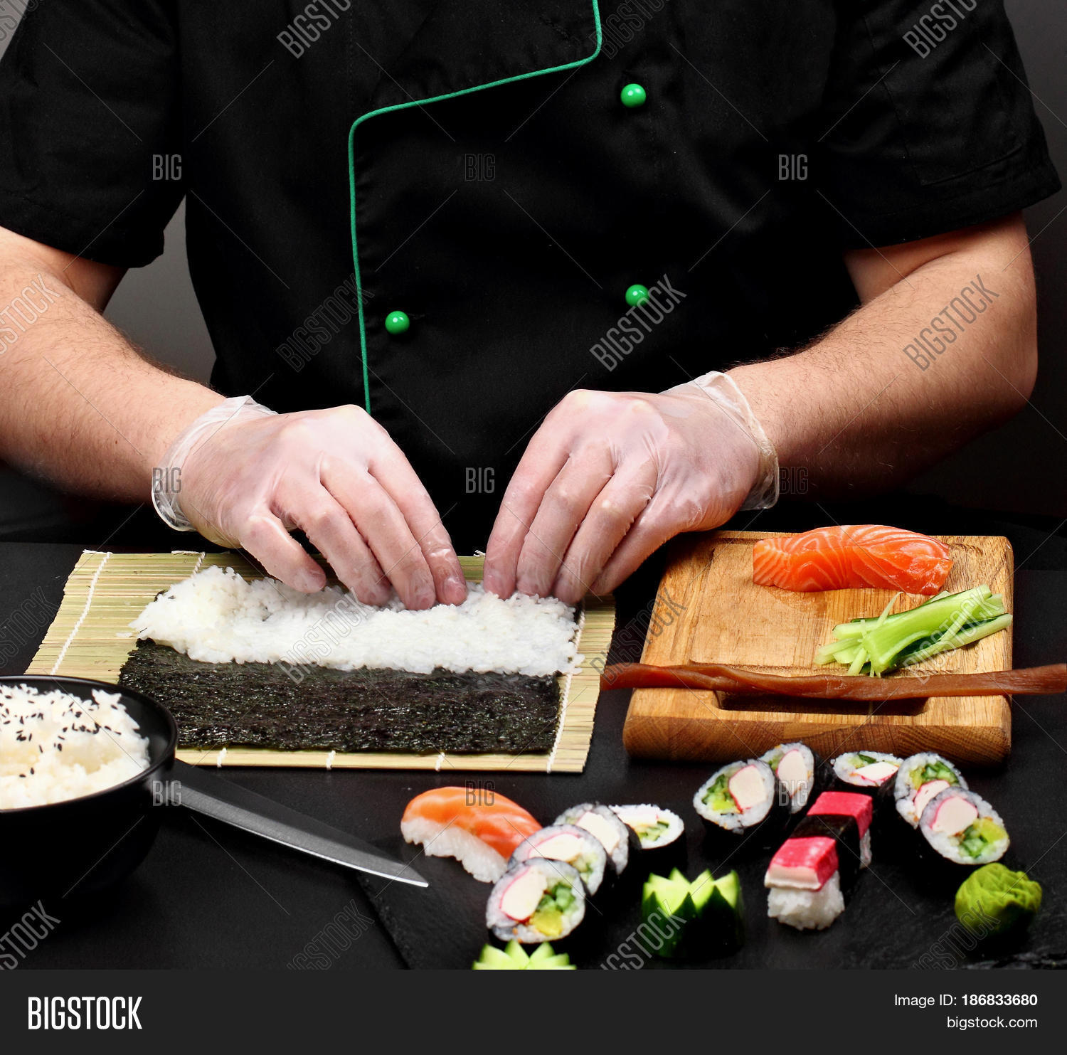 chef making sushi .