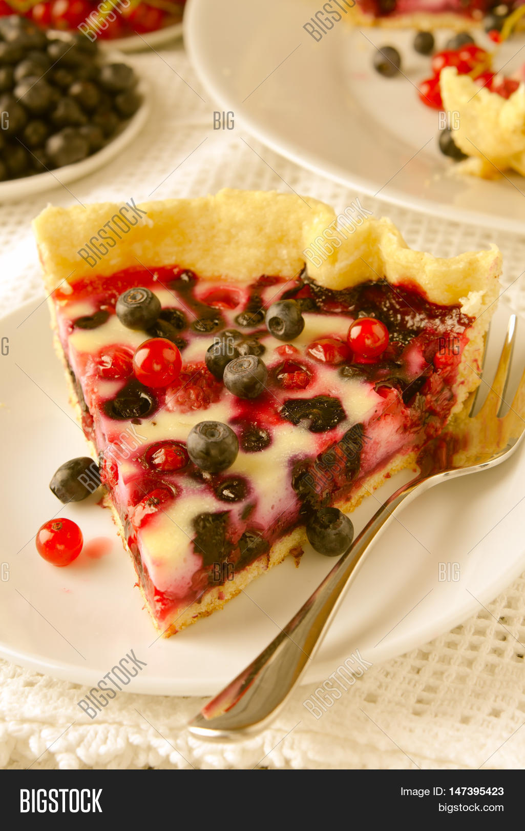 mix berry tart, pie, cake with raspberries, bilberries, blu